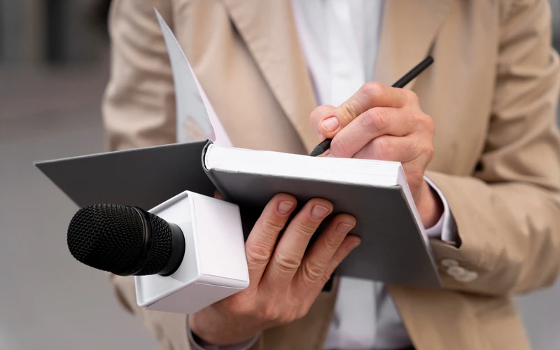 female-journalist-taking-notes